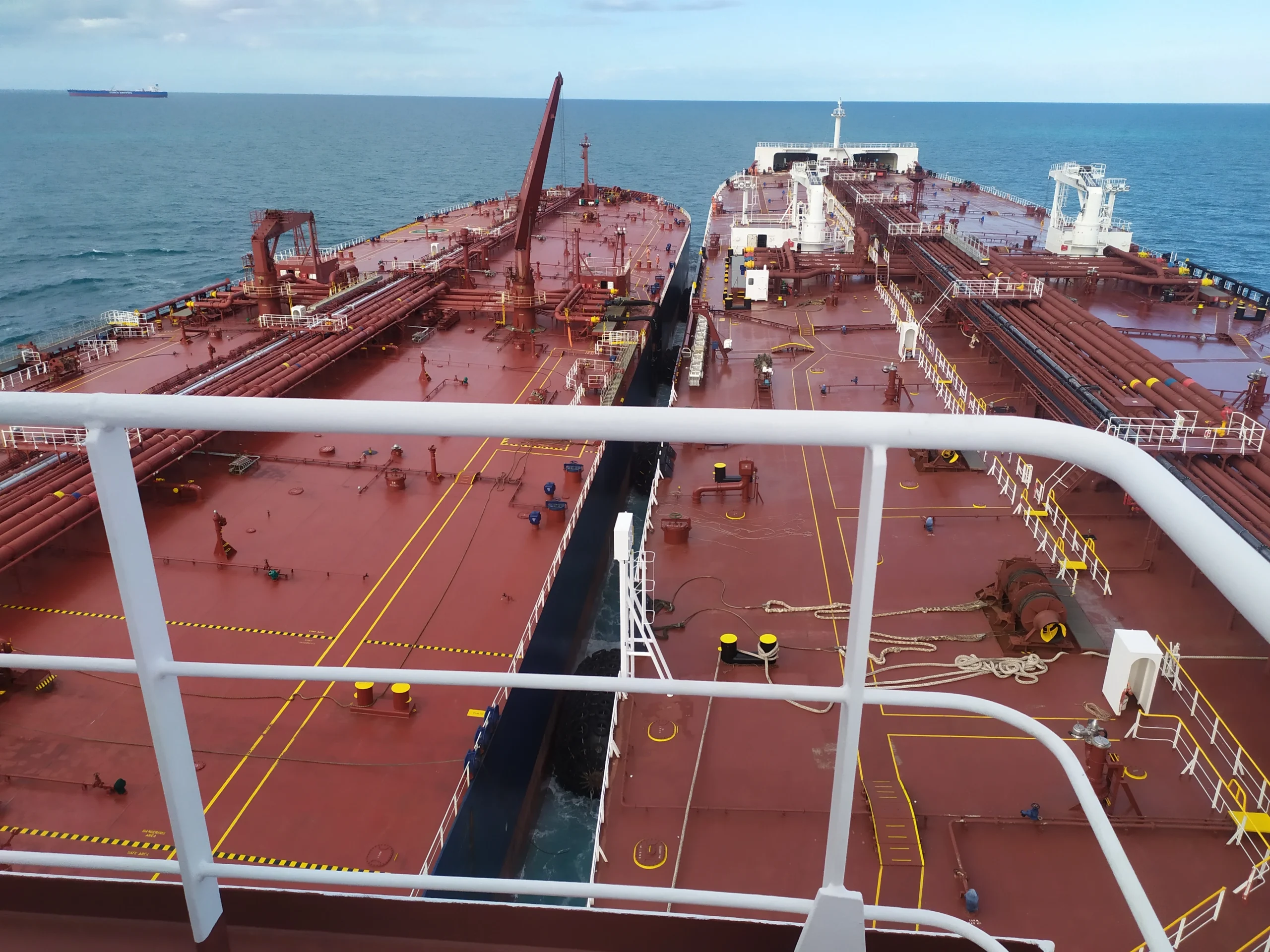 Two tankers alongside during a Ship-to-Ship operation at sea