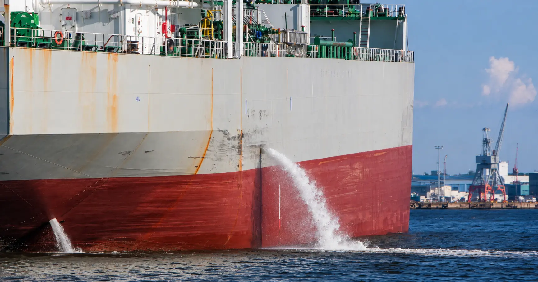 Ship discharging ballast water during ballast water treatment operations