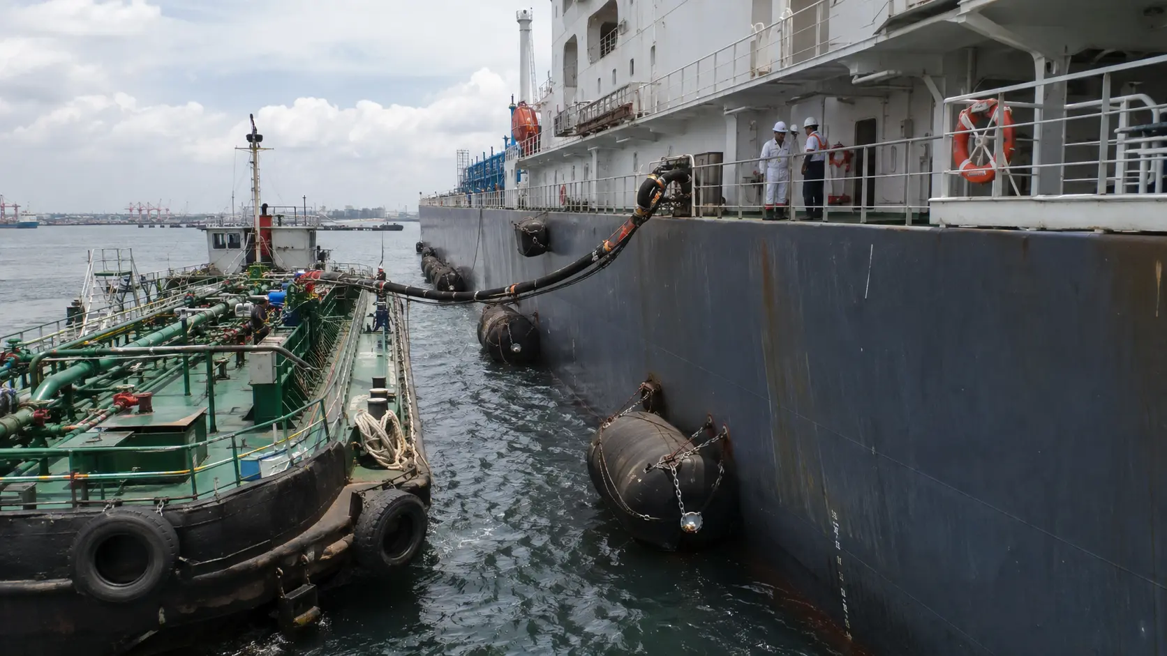 Bunkering operations – bunker barge supplying fuel to a merchant ship